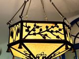 a chandelier hanging from the ceiling in a room
