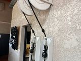 a white wall with a bunch of wires attached to it