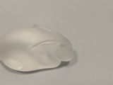 a white computer mouse sitting on top of a white table