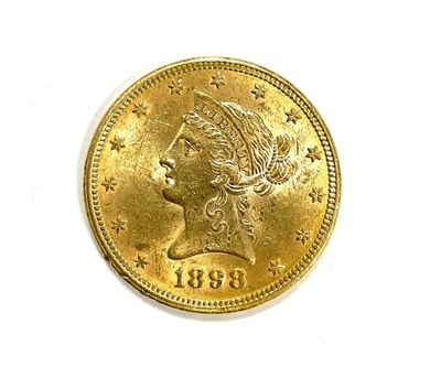 a close up of a coin on a white surface