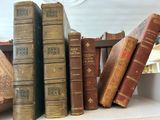 many old books sitting on a shelf in a room