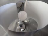 a light that is on in a white bowl