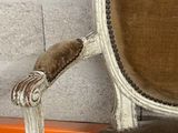 a chair that is sitting in front of a wall