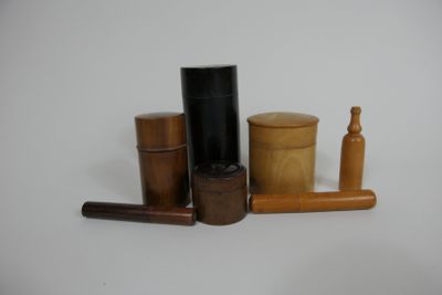 several different types of wooden containers on a white surface