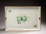 a tray with flowers painted on it on a table