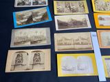 many old photographs of people and buildings on the table