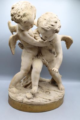 an image of a statue of a boy and a girl holding each other