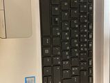 someone is using a laptop computer to open the keyboard on the desk