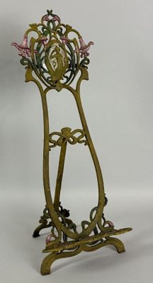 a metal stand with a clock on it on a white background