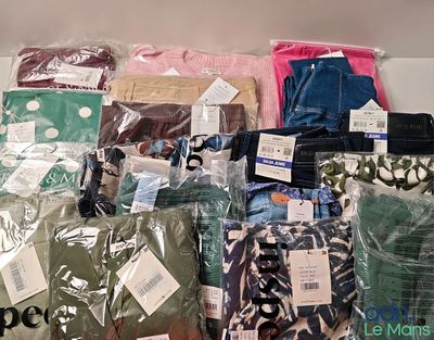 many different types of clothing on display in the store