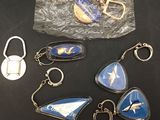 a lot of keychains that are sitting on a table