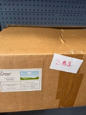 a cardboard box that is sitting on a shelf