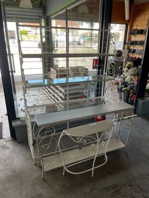 white wrought iron table and chairs in a store