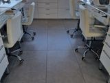 a room with a lot of desks and chairs in it