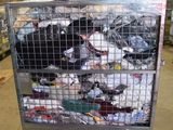 a metal cart with many items in it in a warehouse