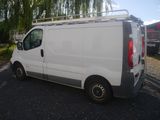 a white van that is parked in the parking lot