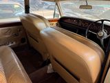 a tan leather car with a steering wheel and dashboard