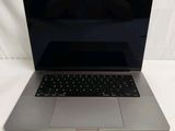 a laptop that is sitting on a white surface