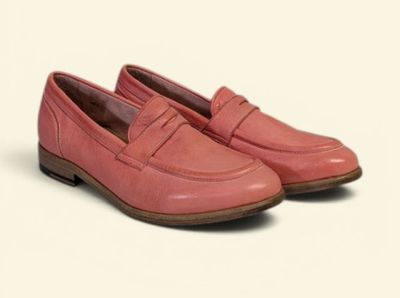 the pink loafer is made of leather and has a rubber sole