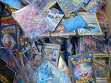 a box full of pokemon cards sitting on a table