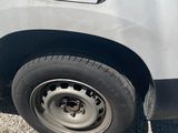a car that has a flat tire on the side of the road