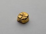 an image of a gold ring with a face on it