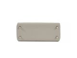 a white purse with a metal clasp on a white background