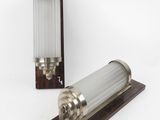 a close up of a light fixture on a wooden stand