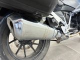 a close up of a motorcycle parked on the side of the road