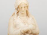 an image of a statue of a woman holding a baby