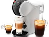 une image d'une machine à café avec une tasse de café à côté d'elle