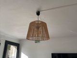 a lamp that is hanging from the ceiling in a room