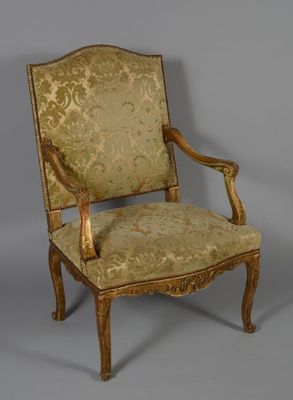 an image of a chair with a gold upholstered back and arms