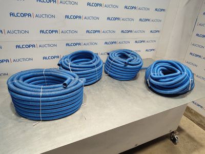 several blue hoses sitting on top of a table in front of a wall