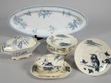 several pieces of blue and white china on a table