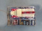 a plastic box with a piece of cheese and a packet of cigarettes