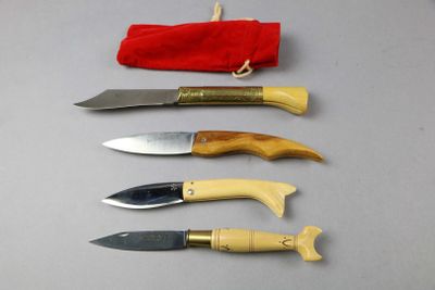 several knives are lined up in a row on a table