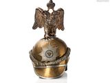 a bronze statue of an eagle sitting on top of a globe