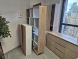 a tall cabinet in the corner of a room