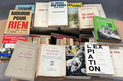several books are stacked on top of each other on a table