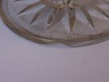 a glass plate with a piece of cake on it