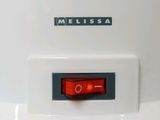 a close up of a white vehicle with a red light