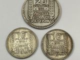 three silver coins, one of which is a 20 cents and one of which is a 20 cents