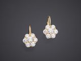 a pair of diamond and gold earrings