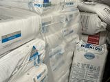 a large pile of toilet paper sitting on top of a pile of boxes