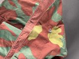 a close up of a shirt with a camouflage pattern on it