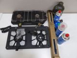 a picture of a stove top with a gas burner and a can of water