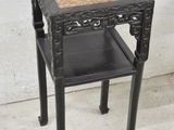 a small table with a drawer on top of it