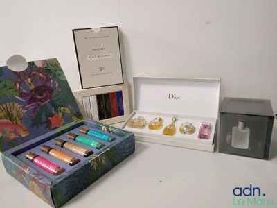 a box of perfumes and a box of perfumes on a table