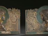 pair of art nouveau bronze bookends of a woman and a man